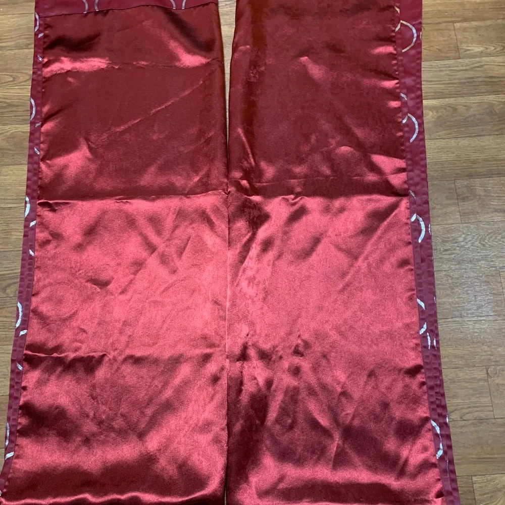 1 pair of burgundy/wine and silver curtains 28” x 84” each panel